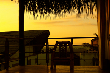 each suite has a private balcony with a view of the ocean.